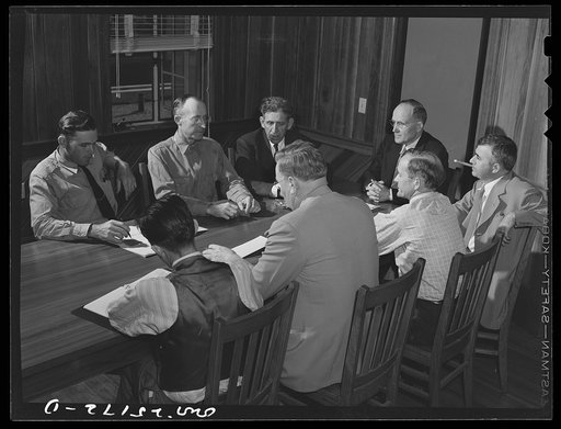 San Augustine, Texas. A meeting of the town council to discuss buying a new water tank to replace the one which was destroyed by the March tornado. Left to right around the table: Troy Mitchell, city manager; J.W. Ritchie, tinner; H.D. Clark, department store owner; Mayor Alonzo Rushing, druggist; M