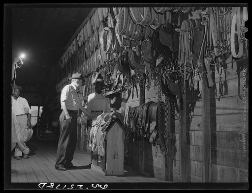 San Augustine, Texas. A customer in the saddle shop