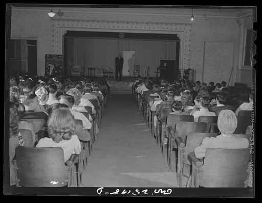 Untitled photo, possibly related to: San Augustine, Texas. The high school student body singing at a general assembly