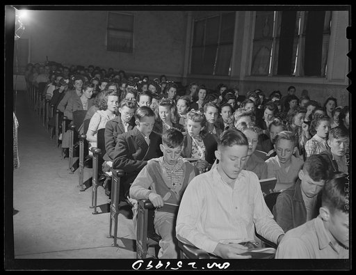 San Augustine, Texas. The high school student body singing at a general assembly