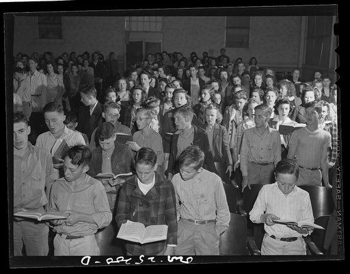San Augustine, Texas. A high school student body singing at a general assembly