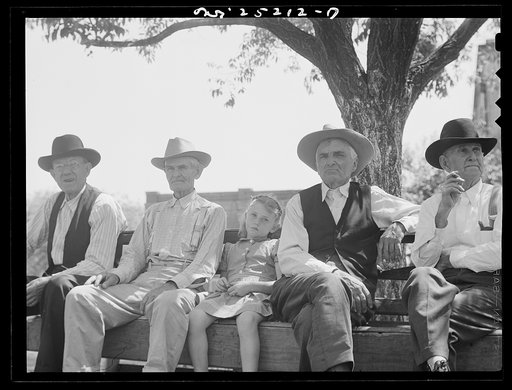 San Augustine, Texas. Sitting on a bench in the courthouse square on Saturday afternoon