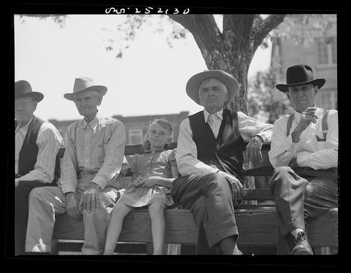 San Augustine, Texas. Sitting on a bench in the courthouse square on Saturday afternoon