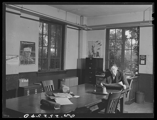 San Augustine, Texas. Robert Norvell, the county judge, in his office