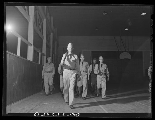 Untitled photo, possibly related to: San Augustine, Texas. The Texas Defense Guard drilling in the high school auditorium