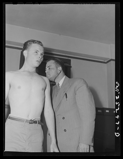 San Augustine, Texas. The eighteen year old grocer's boy receiving a physical examination from Dr. Jones prior to induction into the Army