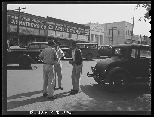 San Augustine, Texas. Farmers talking on the main street on Saturday morning