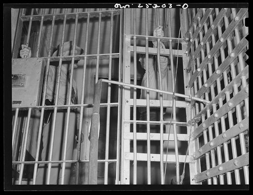 Untitled photo, possibly related to: San Augustine, Texas. Sheriff Jim Halberd [i.e., Halbert] talking with a prisoner in the county jail
