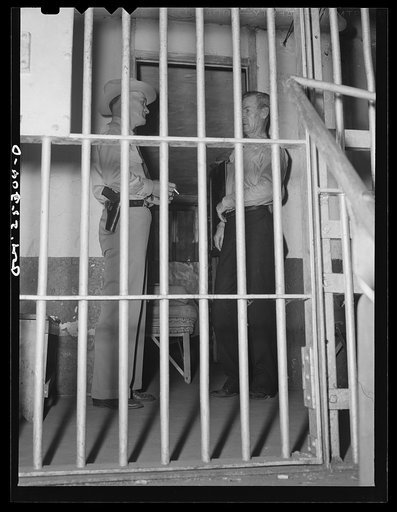 San Augustine, Texas. Sheriff Jim Halberd [i.e., Halbert] talking with a prisoner in the county jail
