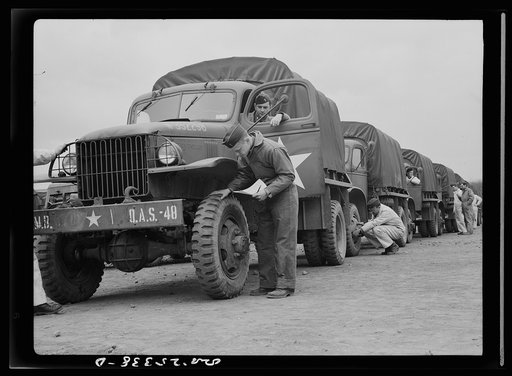 Holabird ordnance depot, Baltimore, Maryland. Before the departure of a truck convoy, drivers must give all vehicles a thorough checkup, including inspection of tires for uneven wear. A badly or spottily worn tire will be sent to the depot's recapping shop