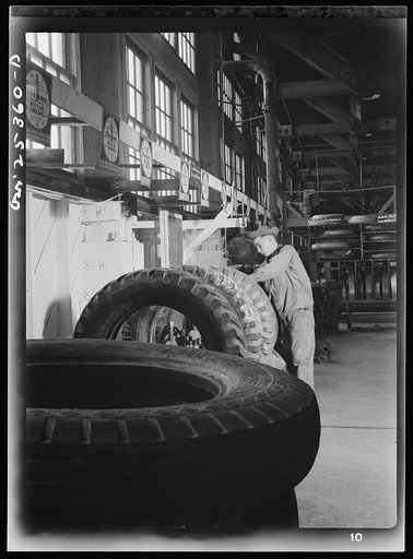 Holabird ordnance depot, Baltimore, Maryland. After having been repaired, tires which need only spot recapping are cured in these section molds. They remain in these molds under pressure for about one hour and forty-five minutes