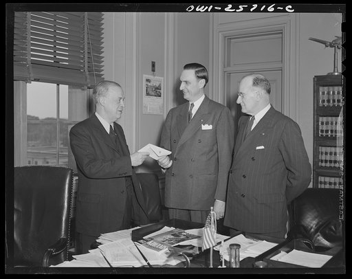Washington, D.C. April 7, 1943. Joseph B. Eastman, director, Office of Defense Transportation (left); O.E. Peterson of Chicago, Illinois, secretary, Kiwanis International (center); and Charles S. Donley of Pittsburgh, Pennsylvania, immediate past president, Kiwanis International
