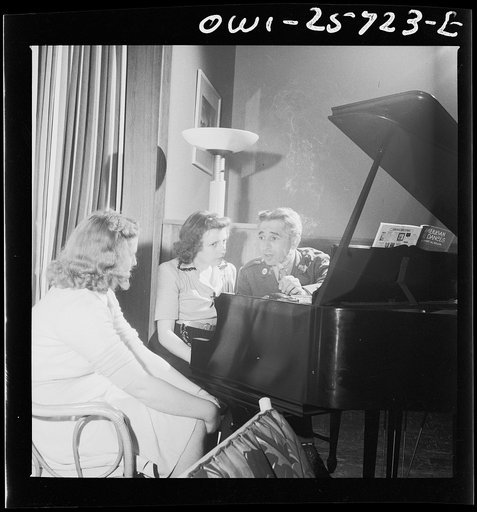 Arlington, Virginia. A group around a piano in the main lounge at Idaho Hall, Arlington Farms, a residence for women who work in the government for the duration of the war