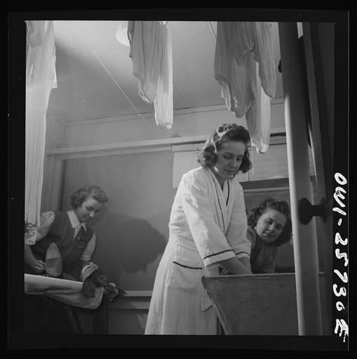 Arlington, Virginia. Washing clothes in one of the laundry rooms at Idaho Hall, Arlington Farms, a residence for women who work in the government for the duration of the war