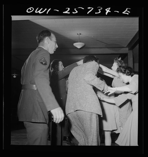 Untitled photo, possibly related to: Arlington, Virginia. Dancing the Virginia reel at a bi-weekly Saturday night "open house" dance at Idaho Hall, Arlington Farms, a residence for women who work for the government for the duration of the war