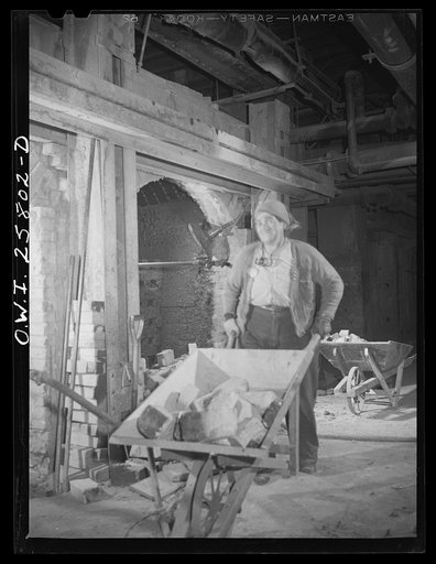 Untitled photo, possibly related to: Buffalo, New York. Women employed inside open hearth furnace as bricklayers' helpers at the Republic Steel. When the end of a chamber is knocked out, there are about 5000 bricks to be lifted and removed. Bricks weigh about eight pounds each