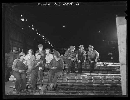 Untitled photo, possibly related to: Buffalo, New York. All "hookers" in the processing department of Republic Steel are women. Resting on a pile of billets, they are eating lunch on the job