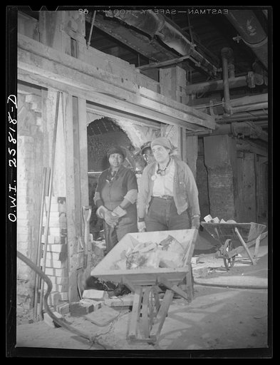 Buffalo, New York. Women employed inside open hearth furnace as bricklayers' helpers at the Republic Steel. When the end of a chamber is knocked out, there are about 5000 bricks to be lifted and removed. Bricks weigh about eight pounds each