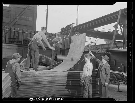 Bethlehem-Fairfield shipyards, Baltimore, Maryland. Bending copper sheeting by hammering and throwing steel billet at the sheet