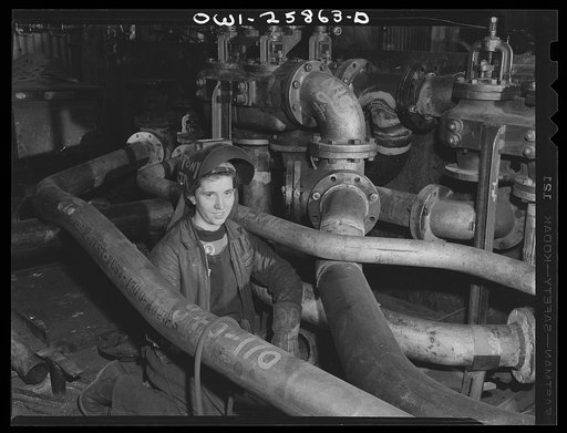 Bethlehem-Fairfield shipyards, Baltimore, Maryland. Girl welder in the pipe shop