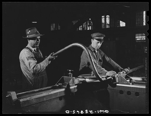 Bethlehem-Fairfield shipyards, Baltimore, Maryland. Bending pipe in a bending machine