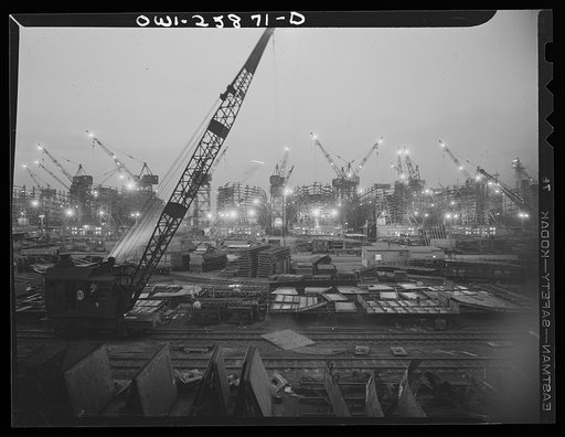 Bethlehem-Fairfield shipyards, Baltimore, Maryland. The shipways at night with a crane in the foreground