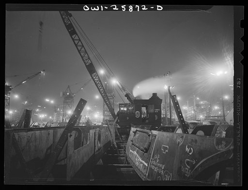 Bethlehem-Fairfield shipyards, Baltimore, Maryland. The shipways at night with a crane in the foreground