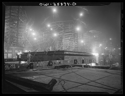 Bethlehem-Fairfield shipyards, Baltimore, Maryland. Ship section in front of the ways at night