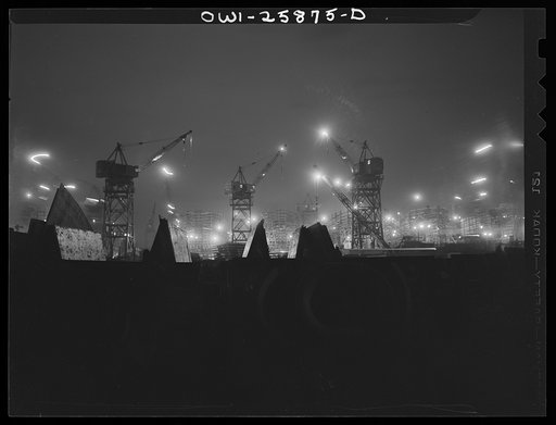 Bethlehem-Fairfield shipyards, Baltimore, Maryland. Ship section in front of the ways at night
