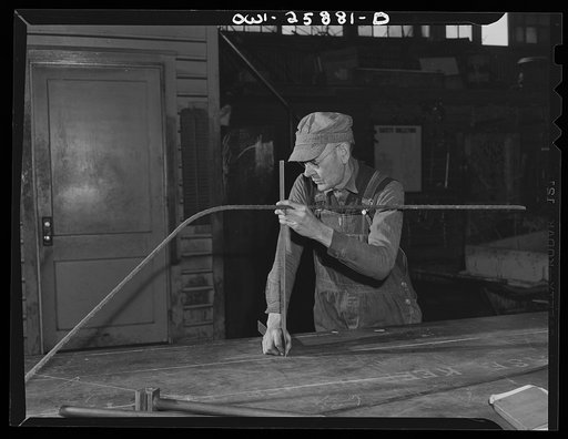 Bethlehem-Fairfield shipyards, Baltimore, Maryland. Forming a master pattern for pipe bending