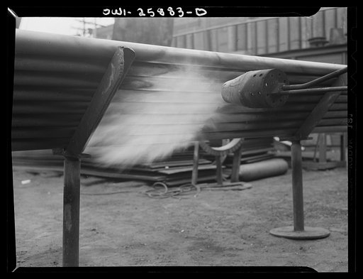 Bethlehem-Fairfield shipyards, Baltimore, Maryland. Heating pipe with a flame thrower