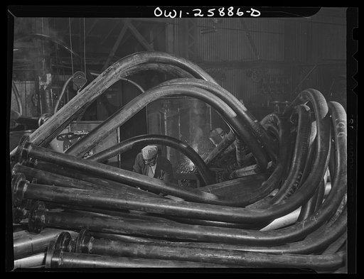 Bethlehem-Fairfield shipyards, Baltimore, Maryland. Welders working on bent pipe