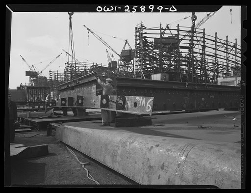 Bethlehem-Fairfield shipyards, Baltimore, Maryland. Hoisting steel sections