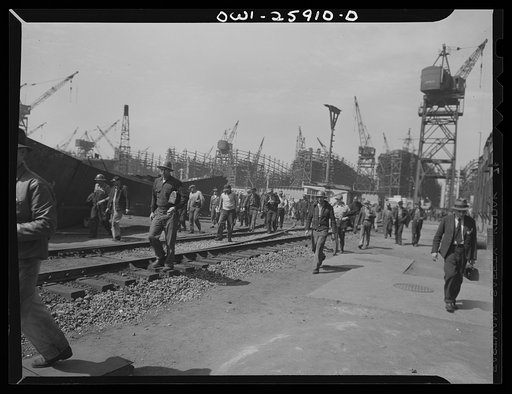Bethlehem-Fairfield shipyards, Baltimore, Maryland. Shipyard workers going off at night