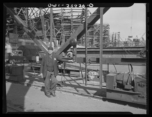 Bethlehem-Fairfield shipyards, Baltimore, Maryland. Safety man at the base of a crane