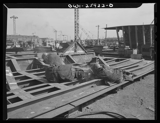 Bethlehem-Fairfield shipyards, Baltimore, Maryland. Welders at work on a steel section