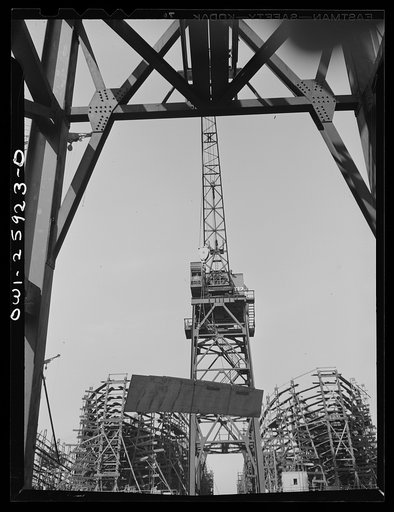 Bethlehem-Fairfield shipyards, Baltimore, Maryland. View through base of a crane toward the shipways