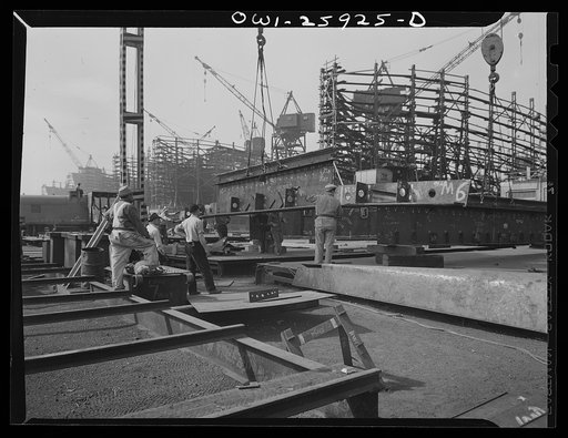 Bethlehem-Fairfield shipyards, Baltimore, Maryland. Lifting a steel section