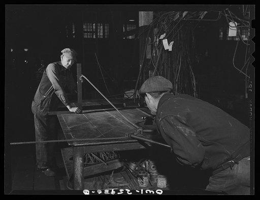Bethlehem-Fairfield shipyards, Baltimore, Maryland. Bending a master form for pipe sections