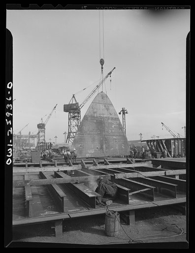 Bethlehem-Fairfield shipyards, Baltimore, Maryland. Lifting a bulkhead section