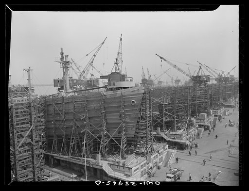 Bethlehem-Fairfield shipyards, Baltimore, Maryland. Painting a nearly finished ship