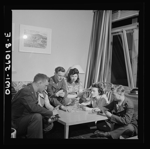 Arlington, Virginia. Girls entertaining their guests in one of the two card rooms, at a residence for the women who work in the U.S. government for the duration of the war. More privacy is afforded here than in the main lounge