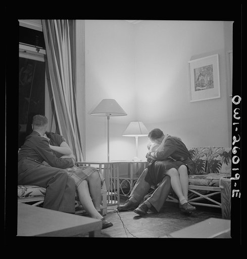 Arlington, Virginia. Girls entertaining their guests in one of the two card rooms, at a residence for the women who work in the U.S. government for the duration of the war. More privacy is afforded here than in the main lounge