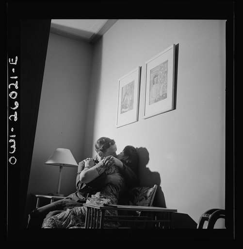 Arlington, Virginia. Girls entertaining their guests in one of the two card rooms, at a residence for the women who work in the U.S. government for the duration of the war. More privacy is afforded here than in the main lounge