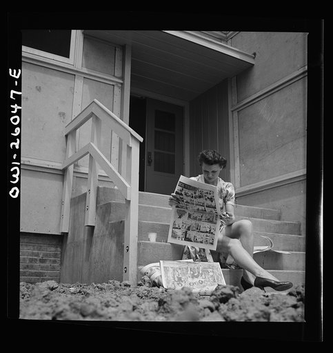 Arlington, Virginia. Reading the Sunday comics on the back porch at Idaho Hall, Arlington Farms, a residence for women who work for U.S. government for the duration of the war