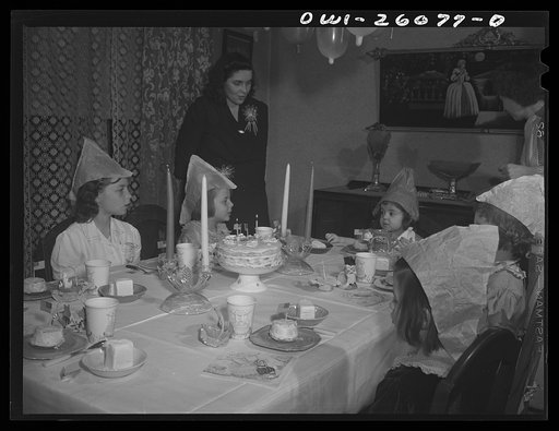 Buffalo, New York. Mrs. Grimm, a twenty-six year old widow, with six children under twelve, is a crane operator in a war plant. Her two youngest children live in a foster home during the week. Their foster mother, Mrs. Hehr, gave a birthday party for Mona, two