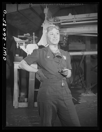 Untitled photo, possibly related to: Buffalo, New York. Symington-Gould, sand slinger operator at rest. Notice sand on her face
