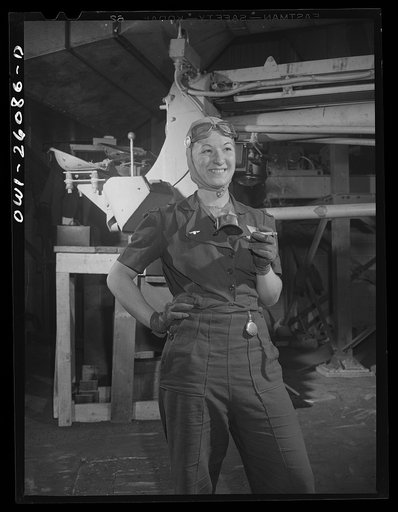 Buffalo, New York. Symington-Gould, sand slinger operator at rest. Notice sand on her face