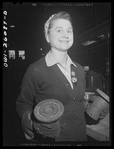 Untitled photo, possibly related to: Buffalo, New York. Laura Czaya painting snubbers, a part of railroad car couplers at Symington-Gould. She is of Polish descent and formerly worked at Gould Battery. Previously she was forelady of a WPA (Work Projects Administration) sewing project. Her husband is