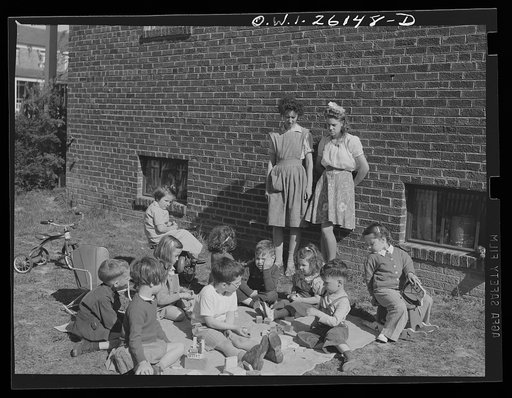 Untitled photo, possibly related to: Washington, D.C. A day nursery for pre-school children of mothers engaged in war work, operated under the supervisor of the District of Columbia Health Department by Mrs. Leroy Bonbrest, at her home at 1144 Branch Avenue, S.E. Children playing in the yard